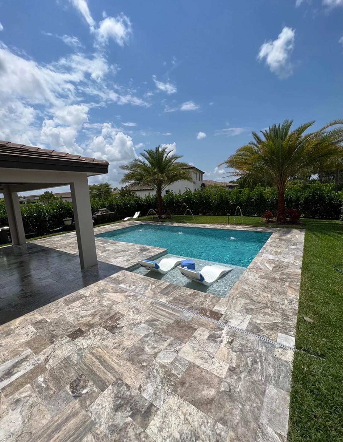 Crew installing a mature palm on a residential property
